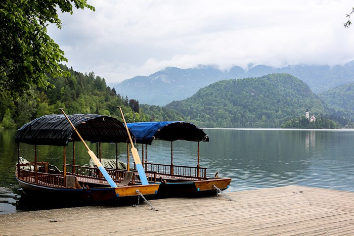 Eastern Europe Slovenia Travel Tourist Lake Bled Pletna Boat Church Mary Row Oars Mountains Steps Monk Stairs Legend Tradition Water Serene Green Scenic