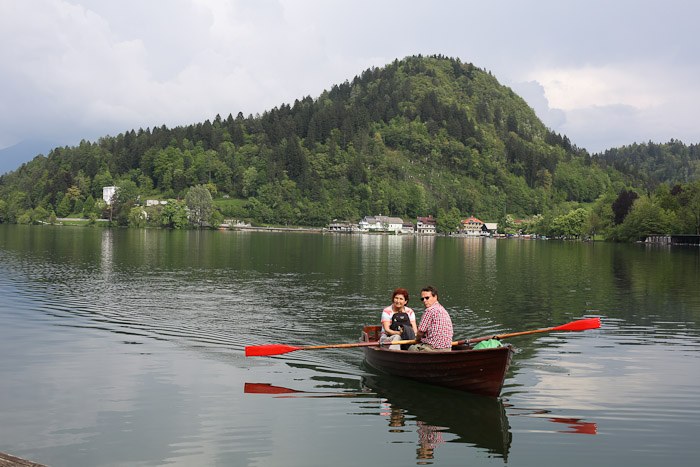 Eastern Europe Slovenia Travel Tourist Lake Bled Pletna Boat Church Mary Row Oars Mountains Steps Monk Stairs Legend Tradition Water Serene Green Scenic chandelier Ring Bell wish couple romantic