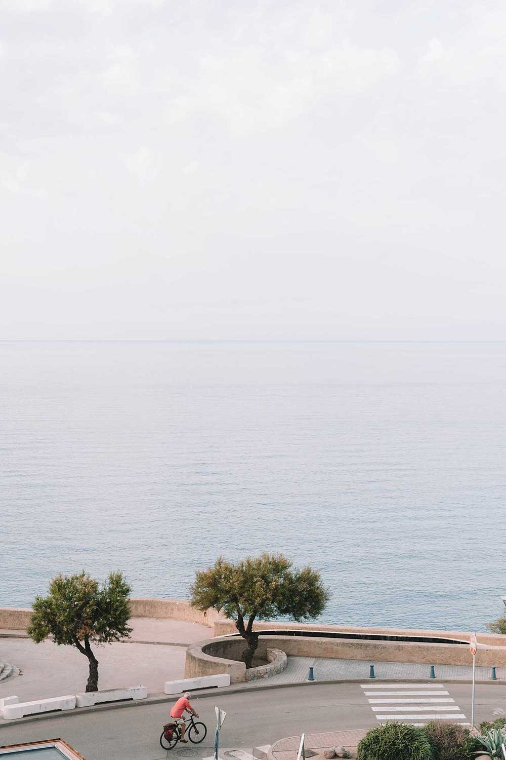 biker-in-calvi-corsica-france-beach