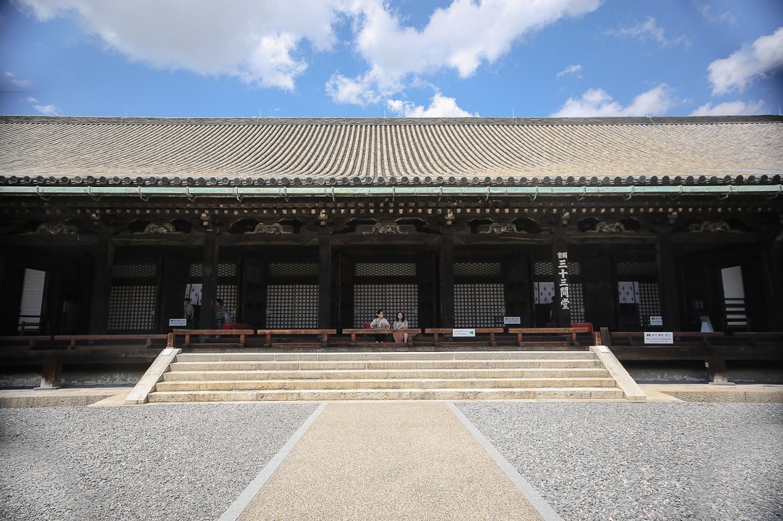 kyoto japan japanese tour tourist travel temple sanjusangendo wooden buddha statues kannon sher she goes orange pray prayer