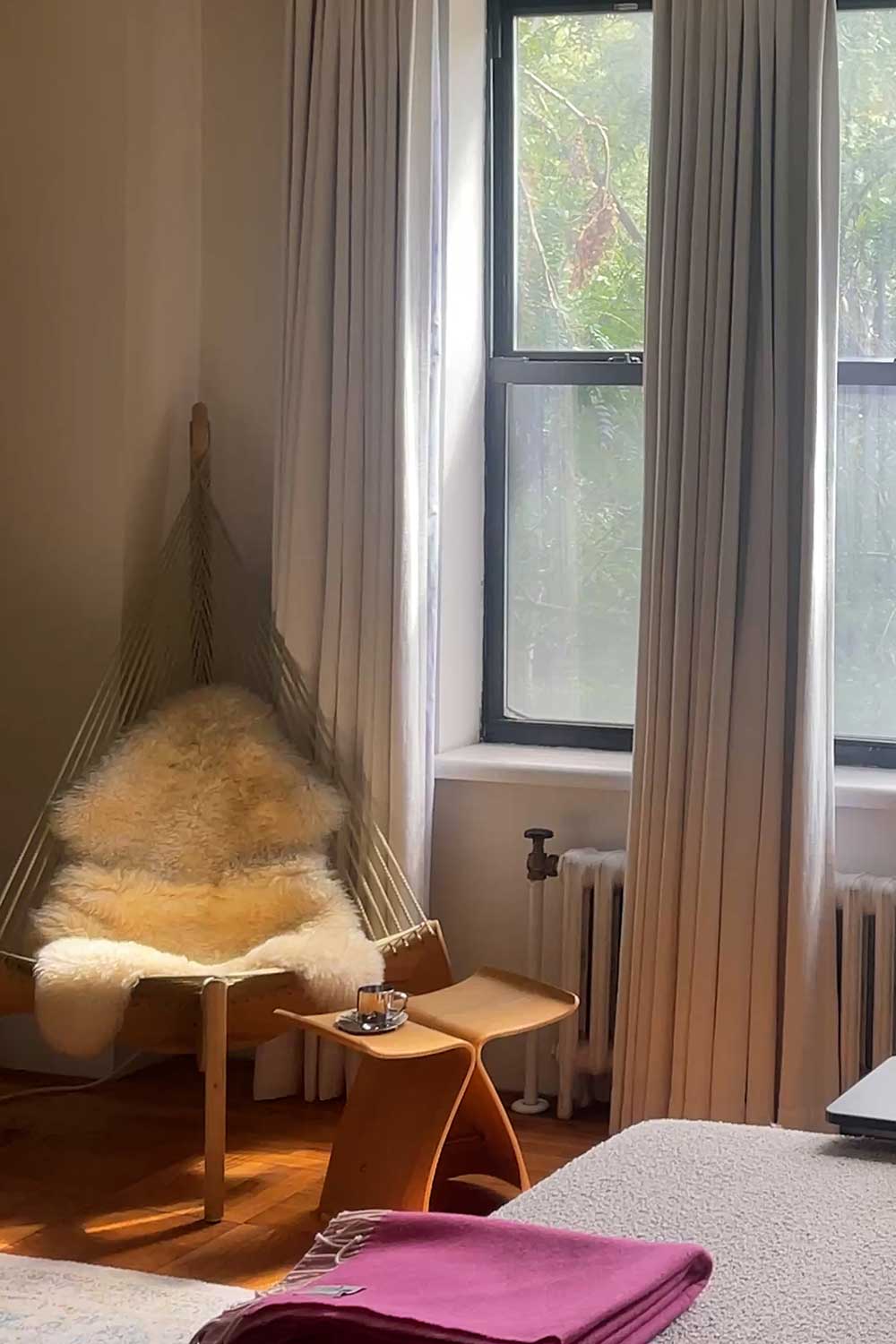 nyc-living-room-reading-nook-with-statement-chair-and-sectional-sofa