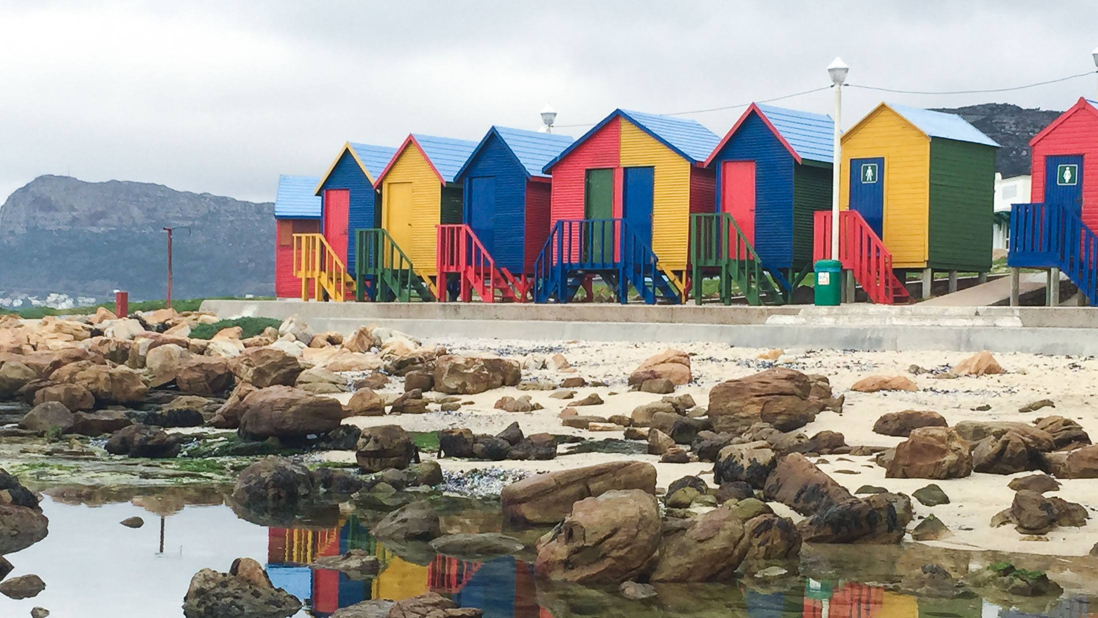 Men fishing from the beach on False Bay at Muizenburg in the